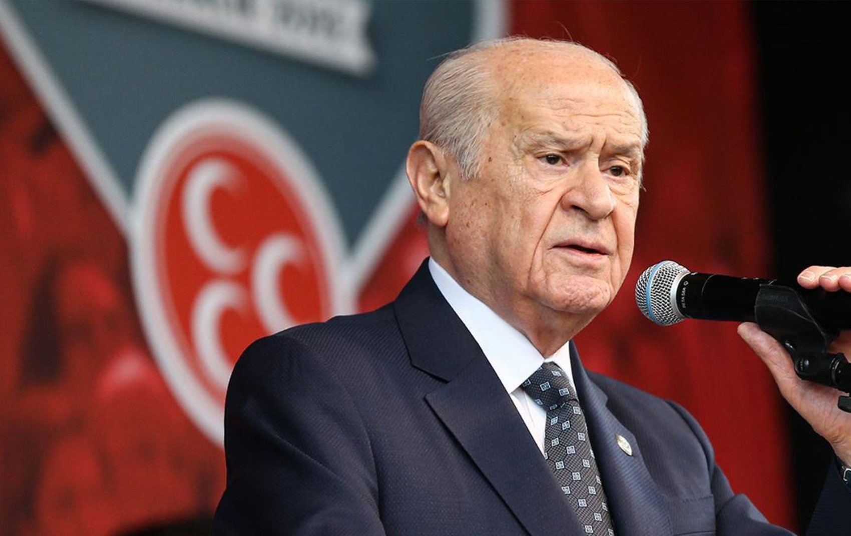 Azmettirme ve suç örgütü kurma suçuyla 13 yıl hapis yattı: Soluğu Bahçeli'nin yanında aldı