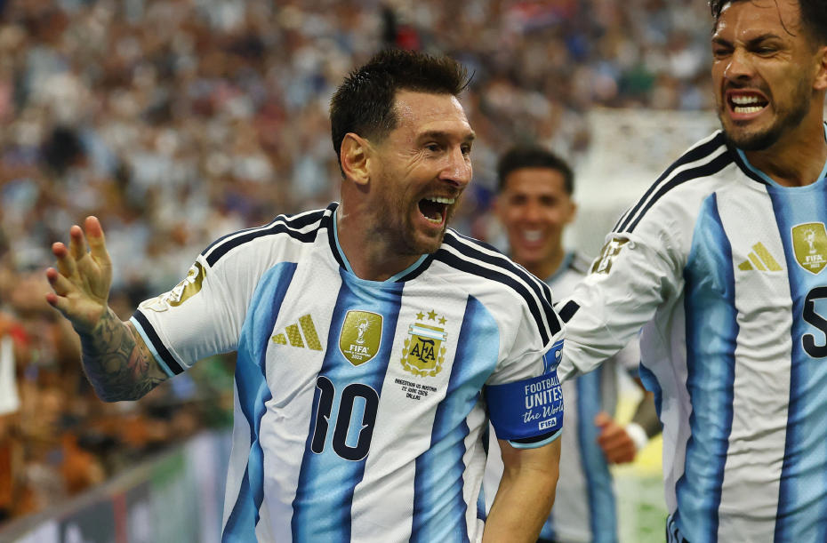 Lionel Messi celebrating during a match in an Argentina jersey.