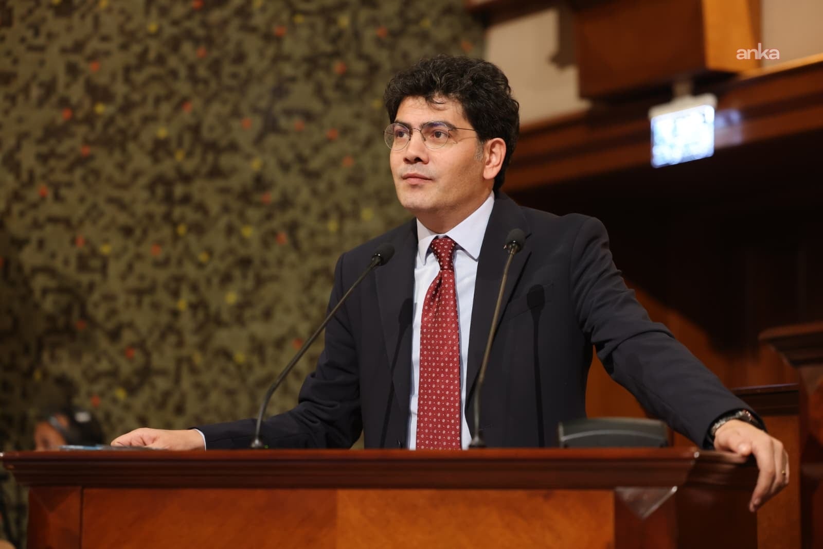 Ahmet Oğuz Demir is giving a speech at the IMM Assembly podium.