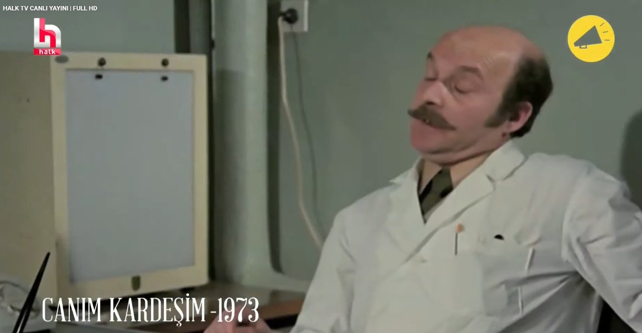 A scene from the 1973 film Canım Kardeşim is shown on the Halk TV live broadcast screen.