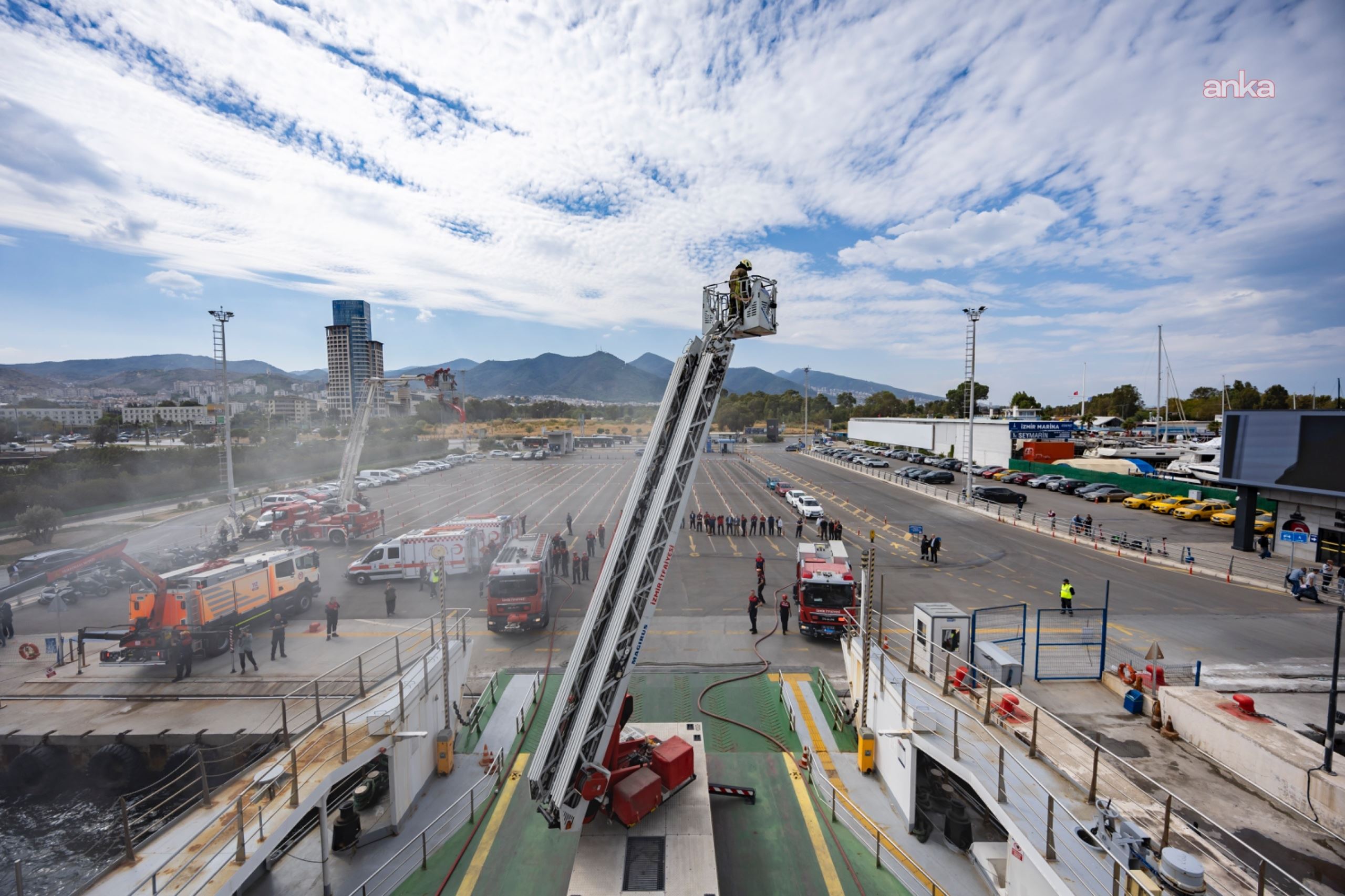 Wide-angle view of the fire drill featuring a car ferry and fire trucks at the Üçkuyular Ferry Terminal.