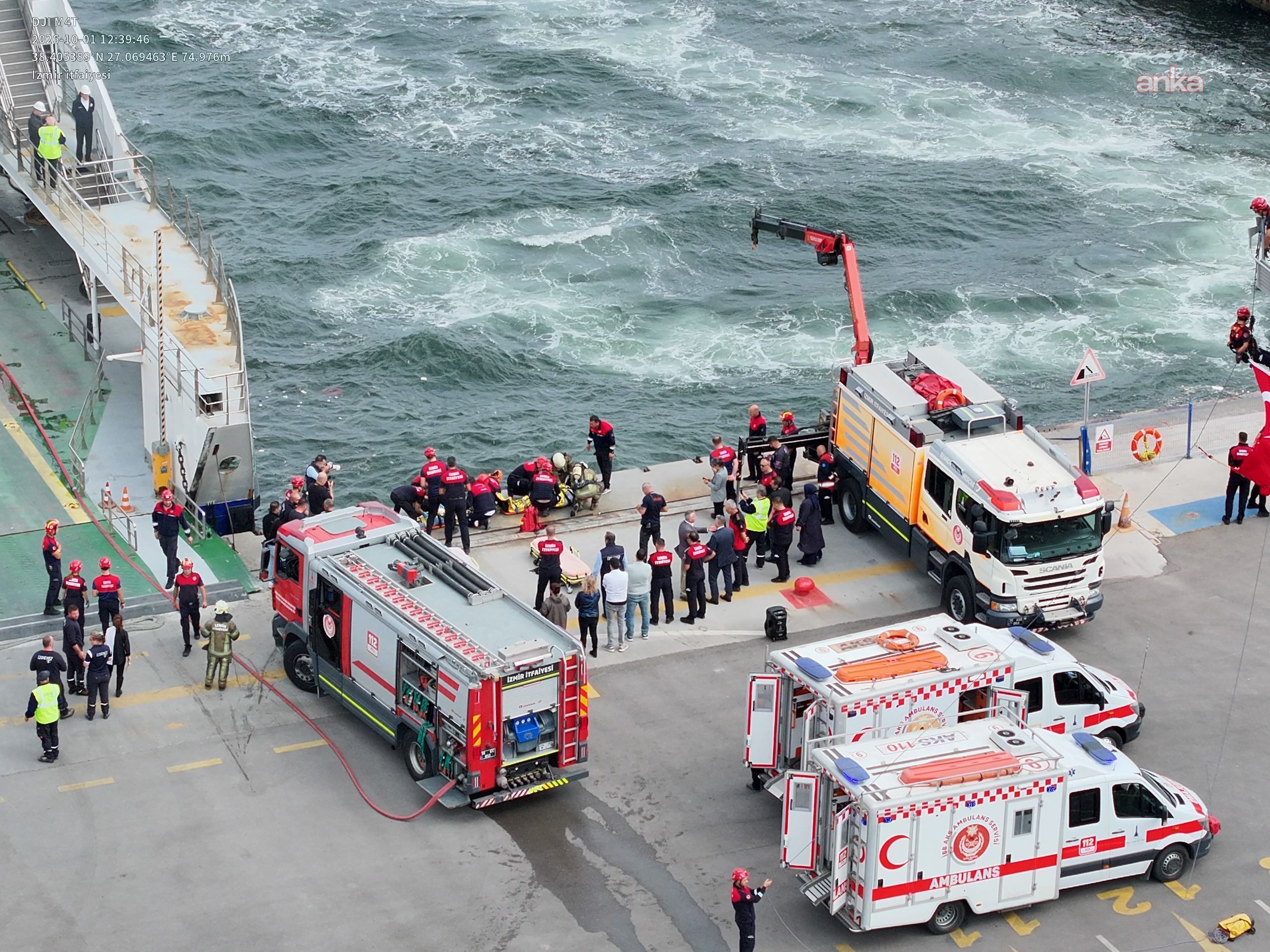 Wide drill area featuring fire trucks, ambulances, and teams at the pier.
