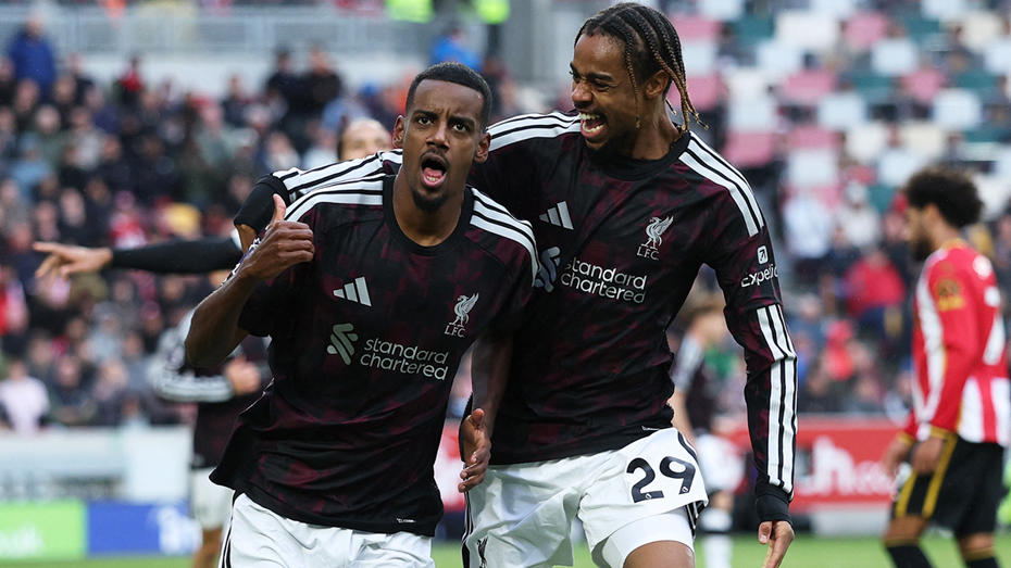 Liverpool players celebrating during a match.