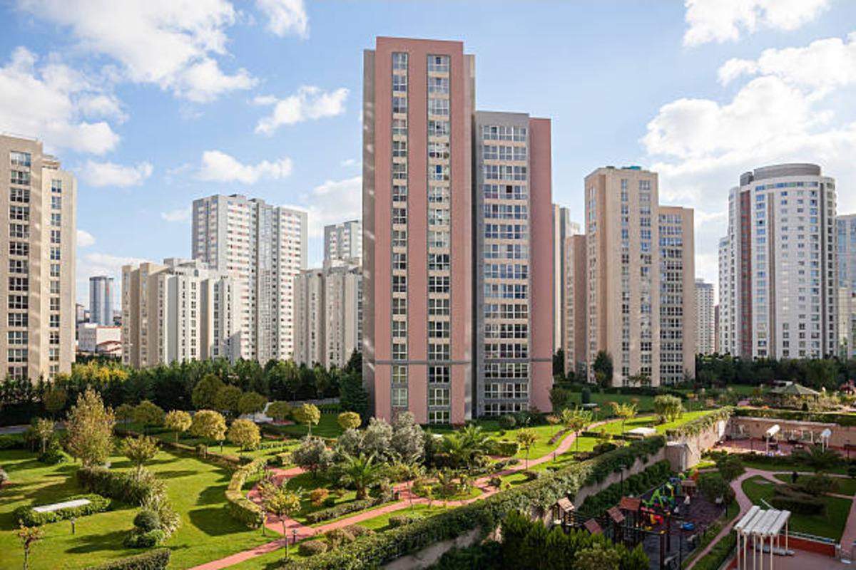 Modern high-rise residences surrounded by green areas.