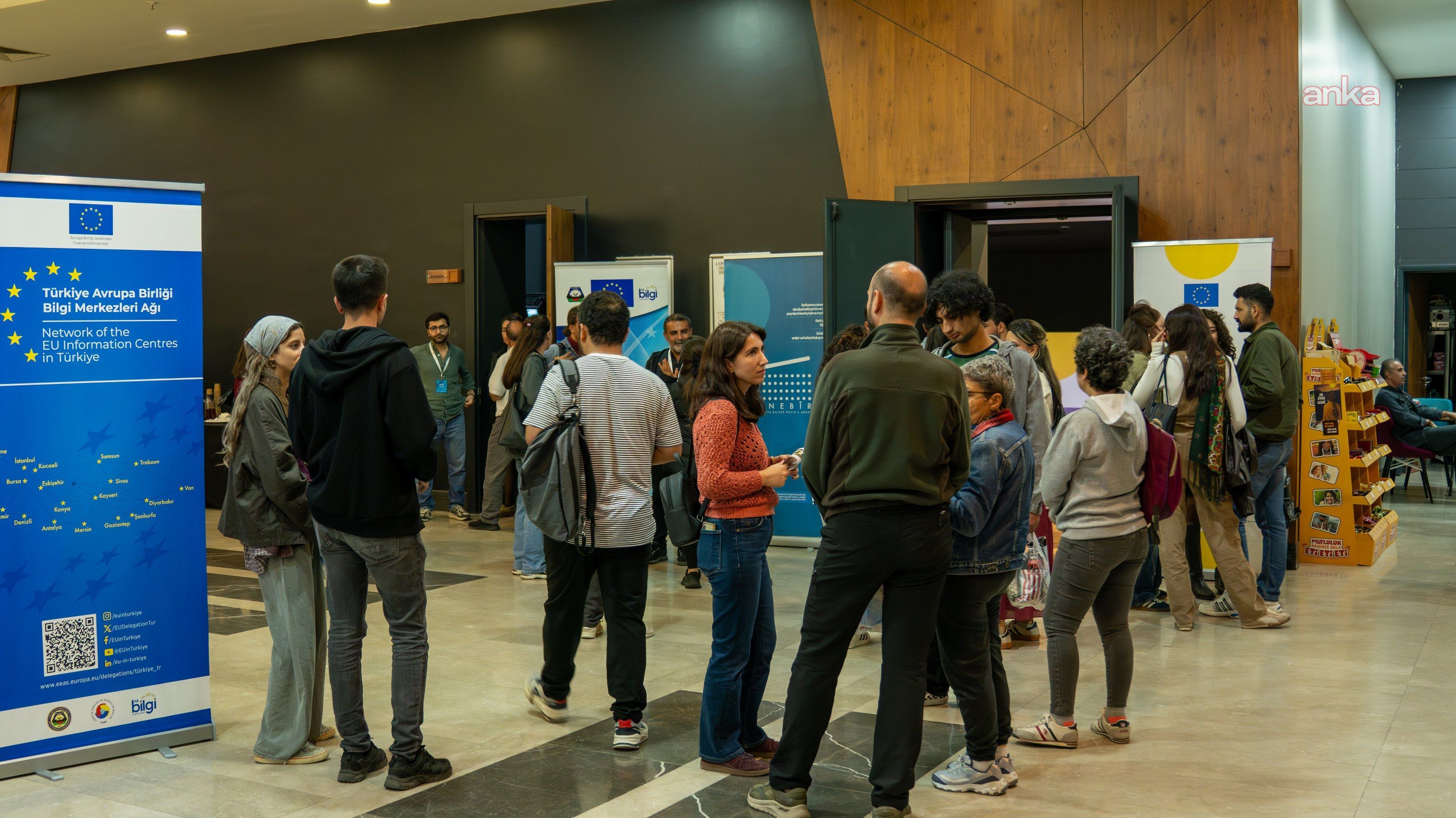 Participants and event stands gathered in the foyer of the culture center at the opening of the European Cinema Days in Diyarbakır.