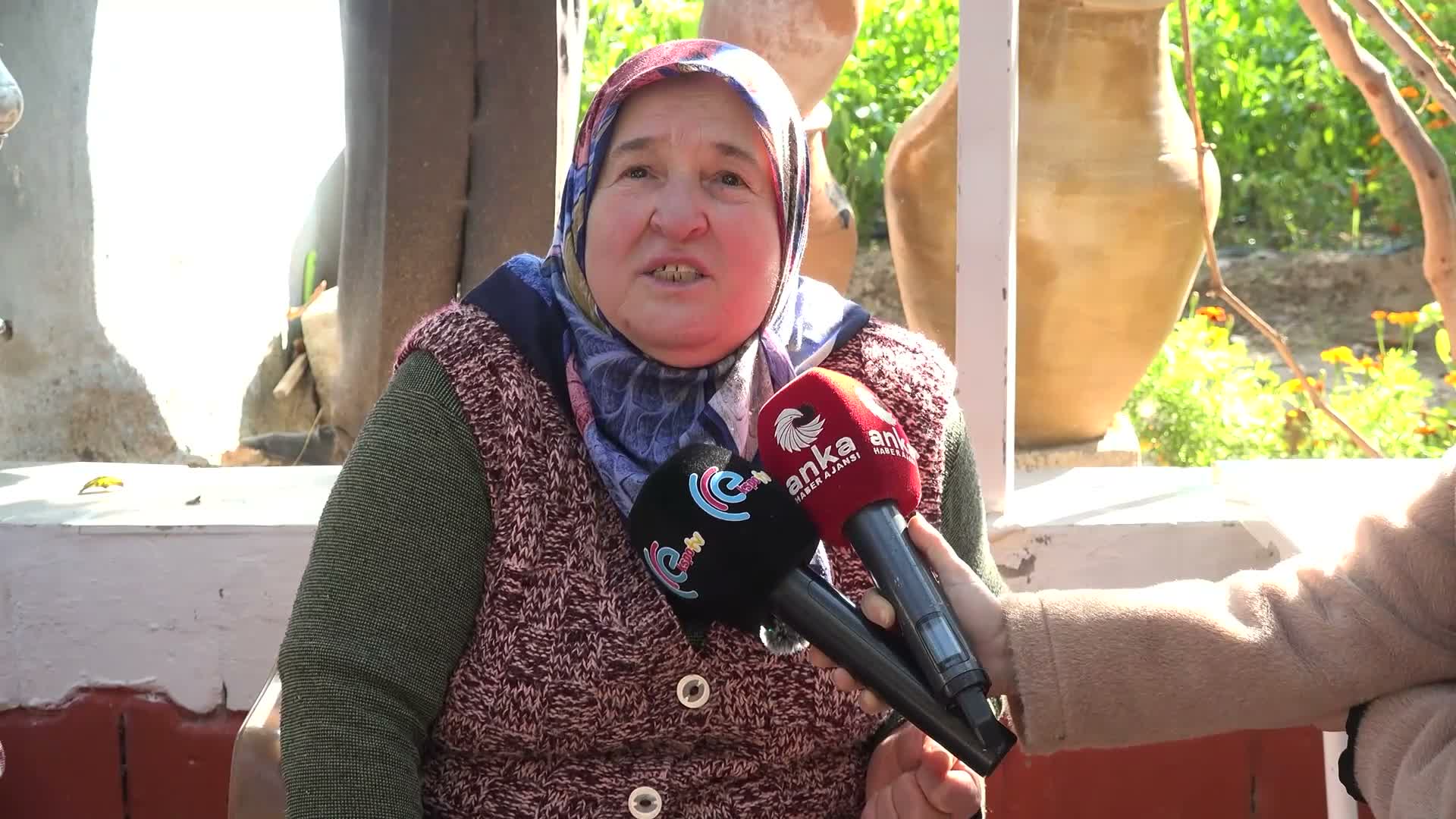 Gül Naziye İnan is seen speaking to microphones in the courtyard of a house.