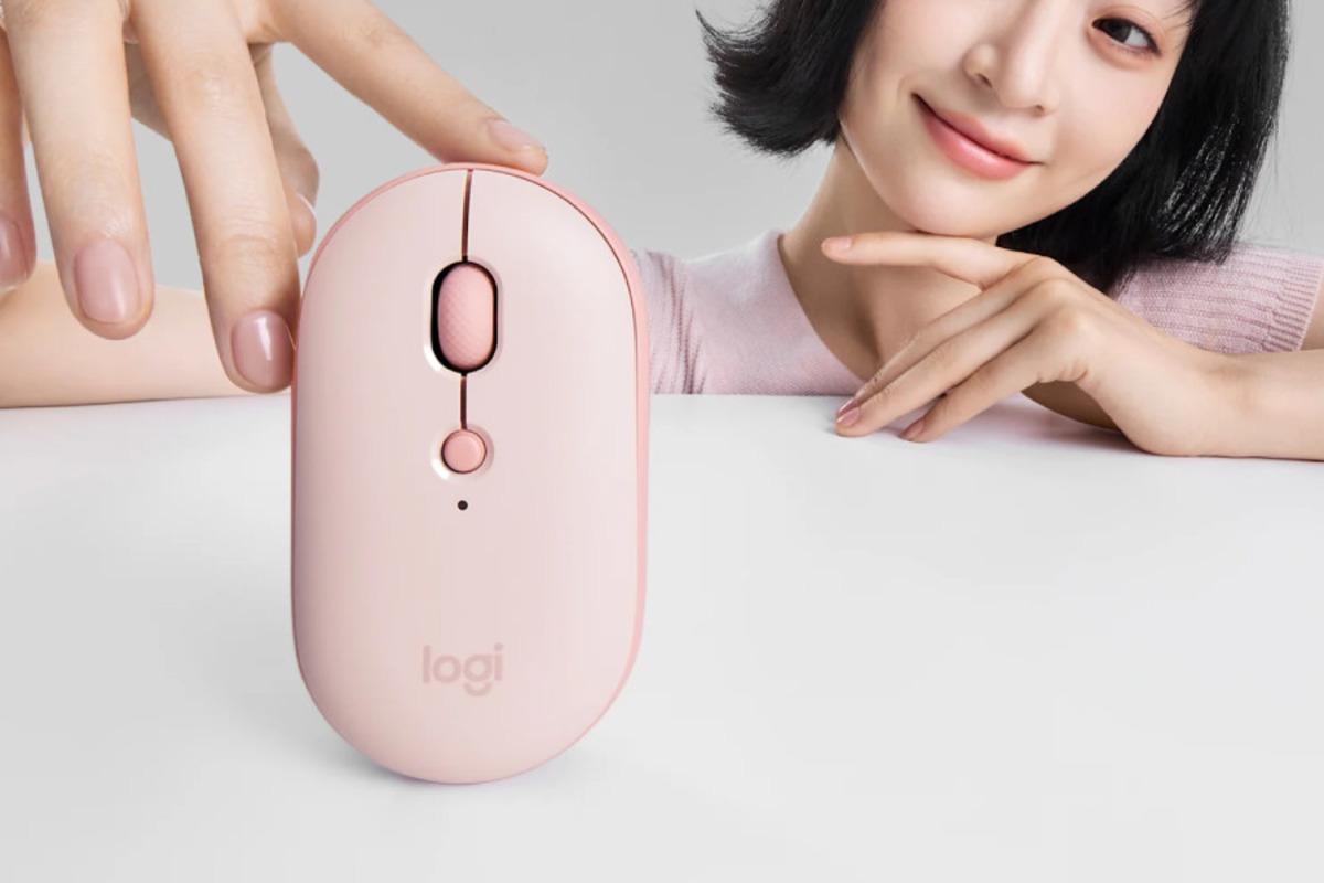 Top view of the pink Logitech Pebble Up mouse; the scroll wheel and DPI button are visible.