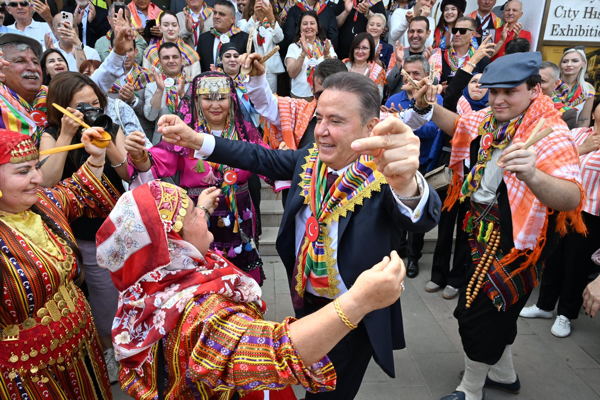 Participants and municipal officials are seen at a crowded event within the scope of the Yörük Turkmen Festival.