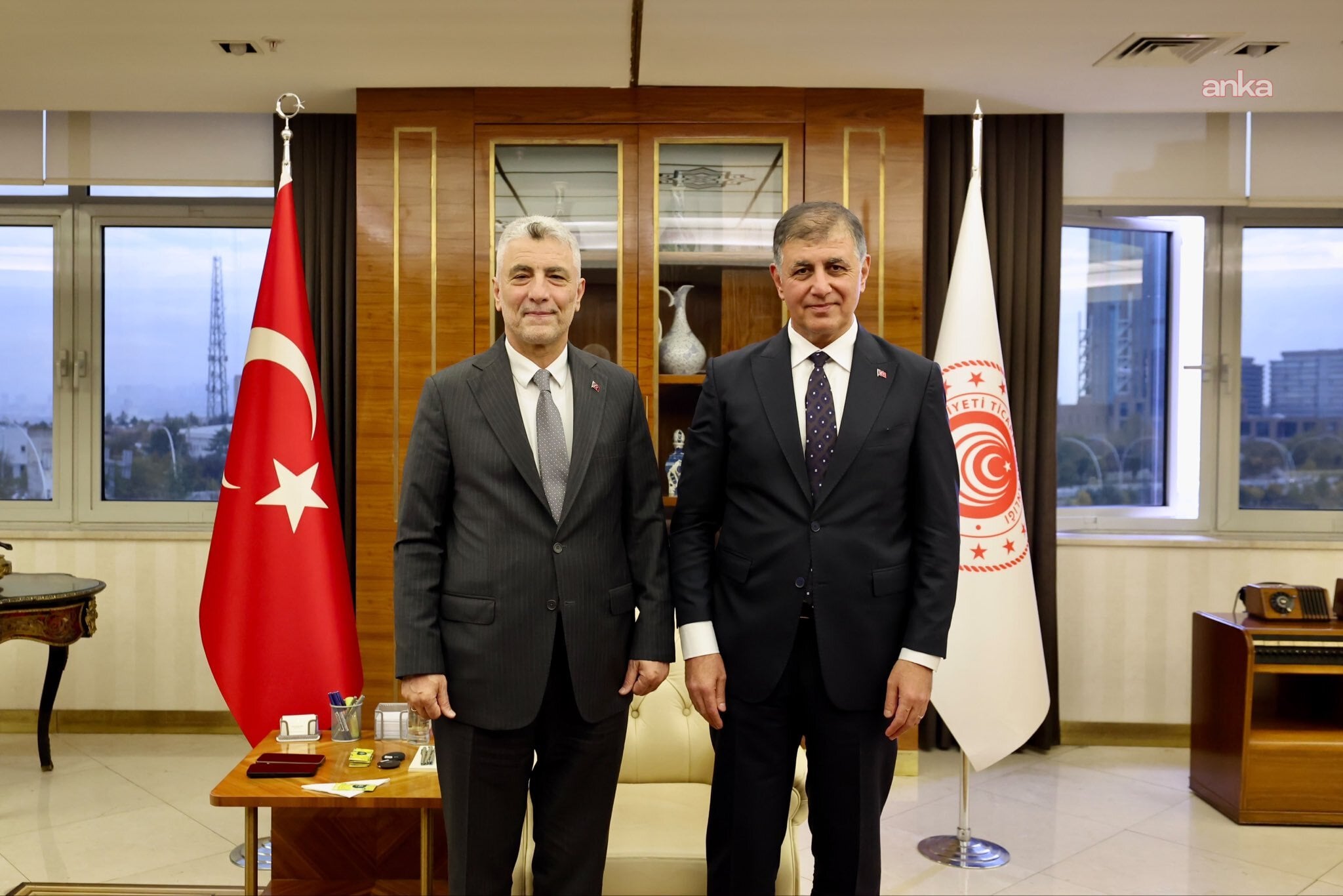 Minister of Trade Ömer Bolat and İzmir Metropolitan Municipality Mayor Cemil Tugay pose together at the ministry office.