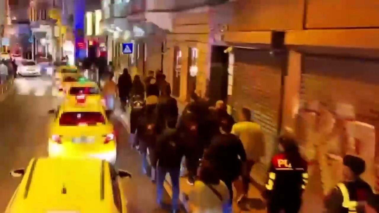 Night footage of police teams moving through the streets of Beyoğlu for inspections.