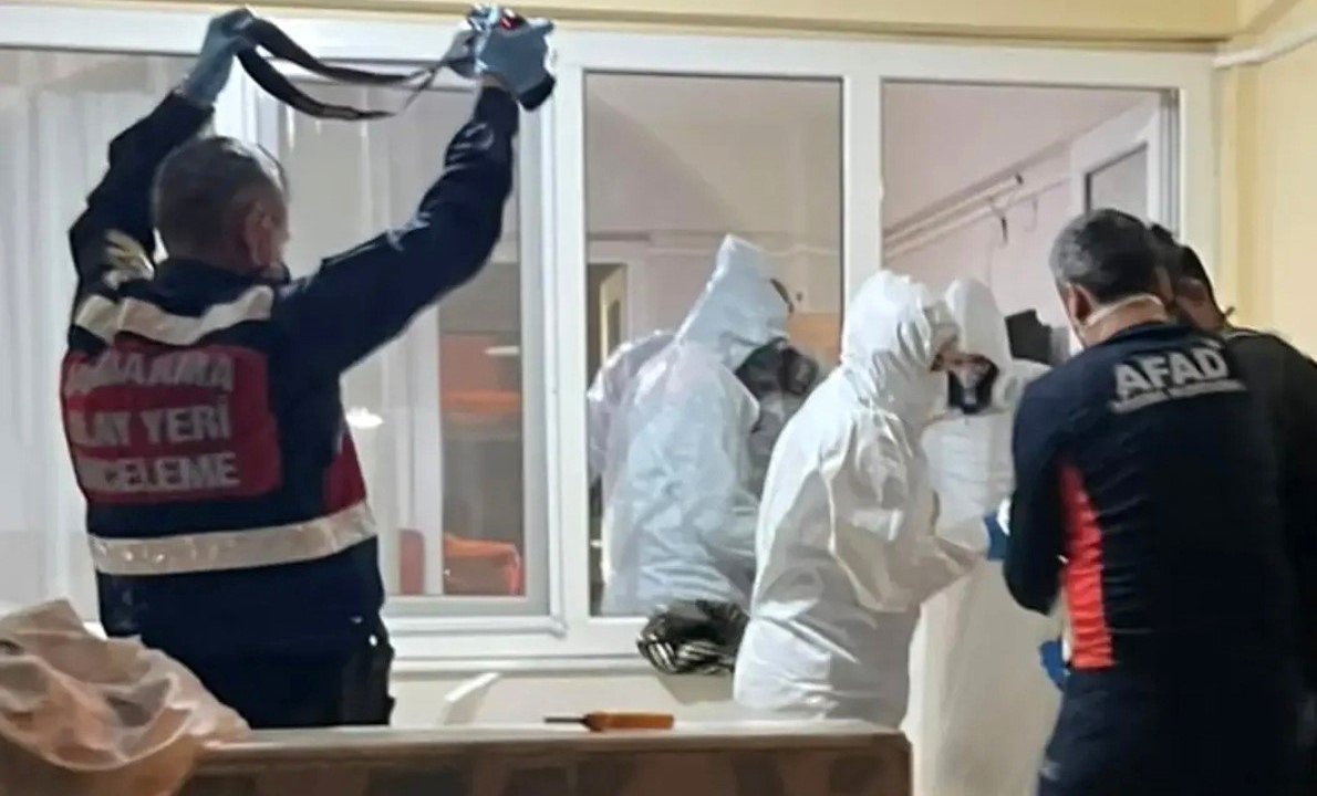 Moment when teams in protective gear and officials conduct an investigation in front of the guesthouse room.