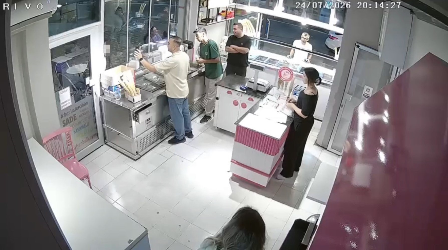 He waved at the person on the mobile phone, then killed the ice cream vendor