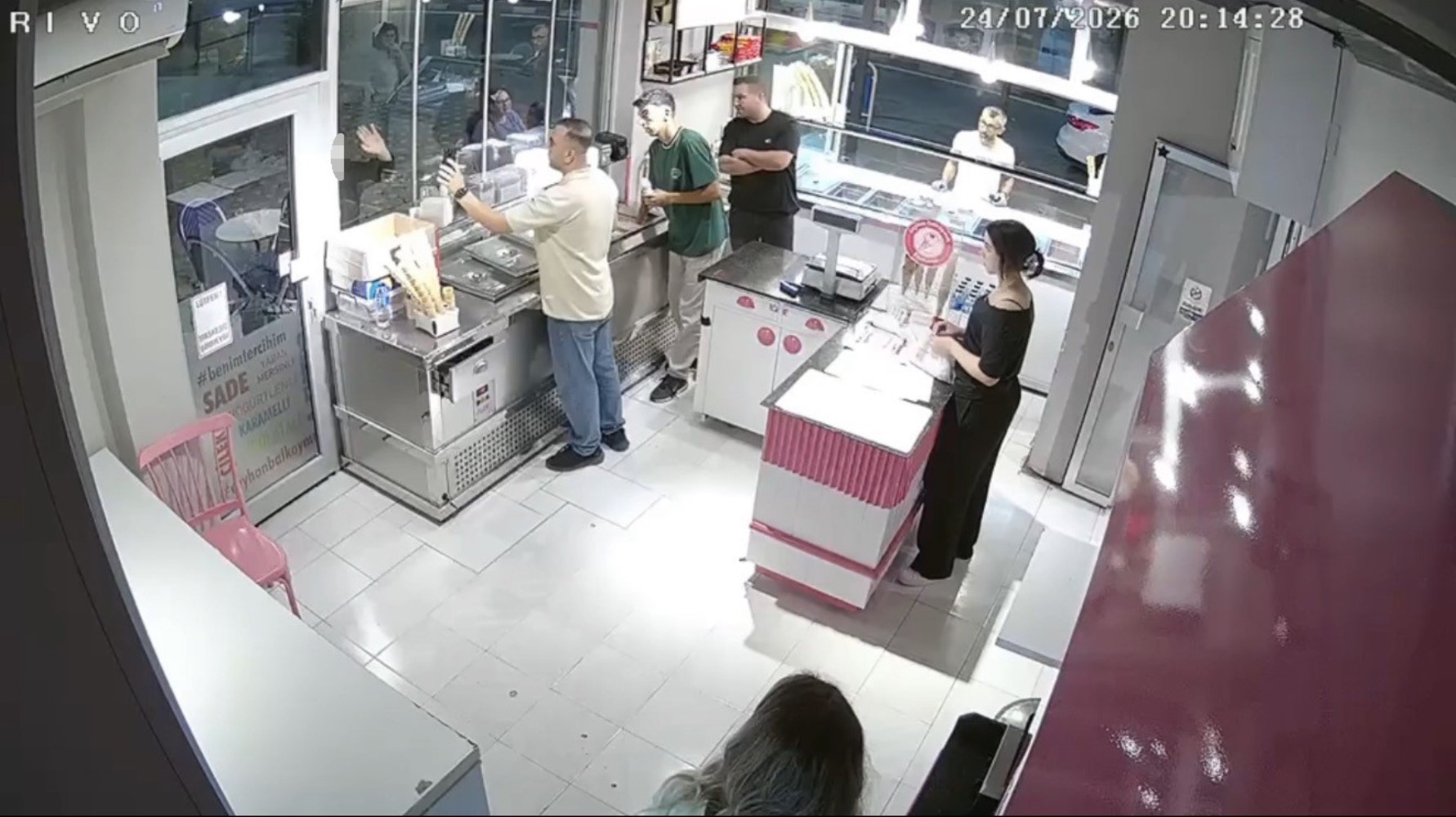 He waved at the person on the mobile phone, then killed the ice cream vendor