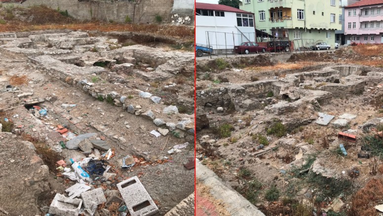 Çöplerin ve yabani otların bulunduğu alanda Roma dönemi hamam kalıntıları görülüyor.
