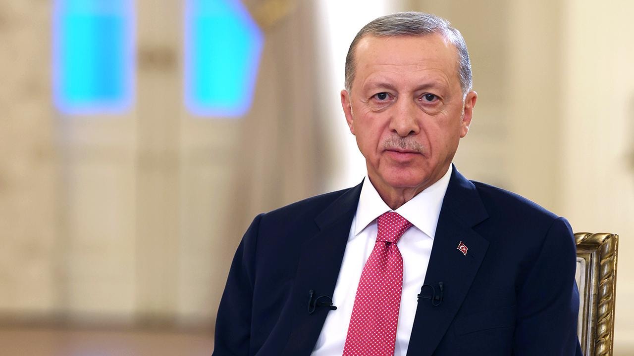 Cumhurbaşkanı Recep Tayyip Erdoğan'ın portre fotoğrafı.