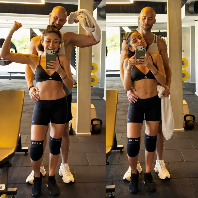 Melek Mosso and Jose Miguel Gonzalez Iglesias posing together in a mirror at the gym.