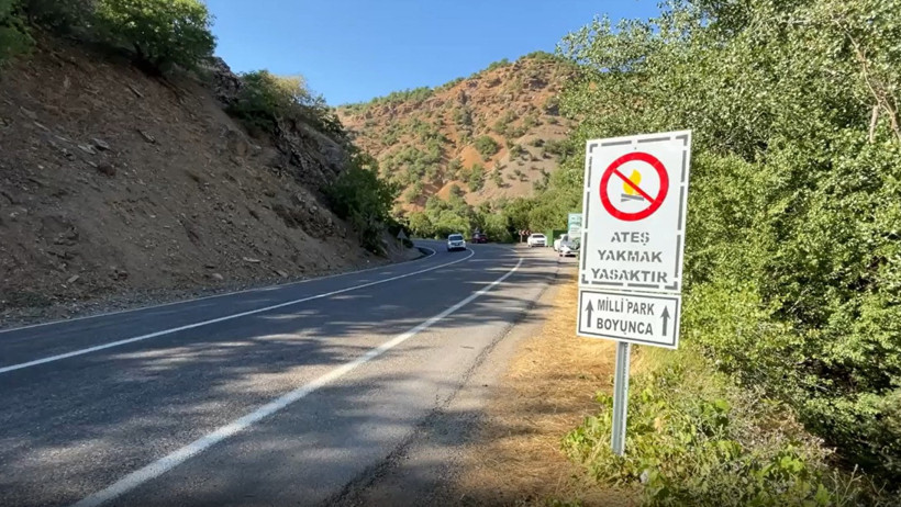 A sign along the road indicating that lighting fires is prohibited throughout Munzur Valley National Park.