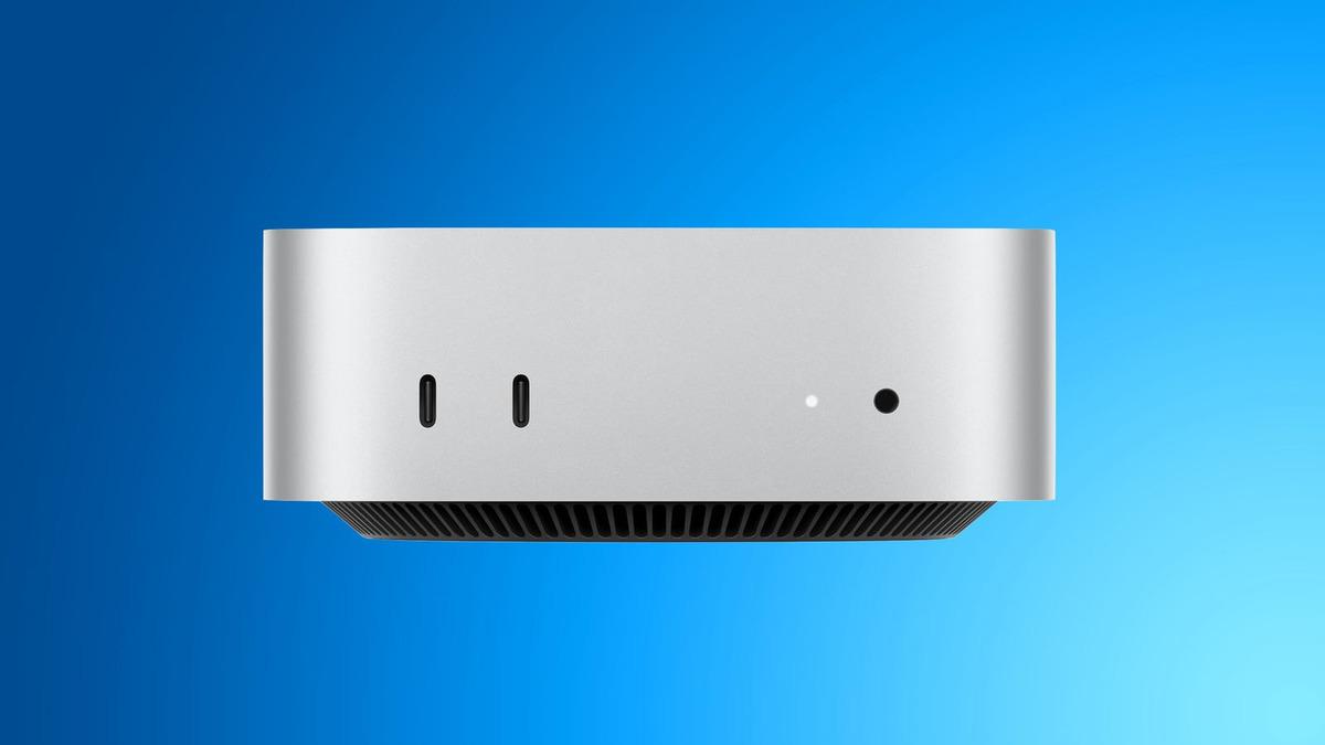 Il modello di Mac mini color argento in formato computer desktop è visibile su uno sfondo blu.