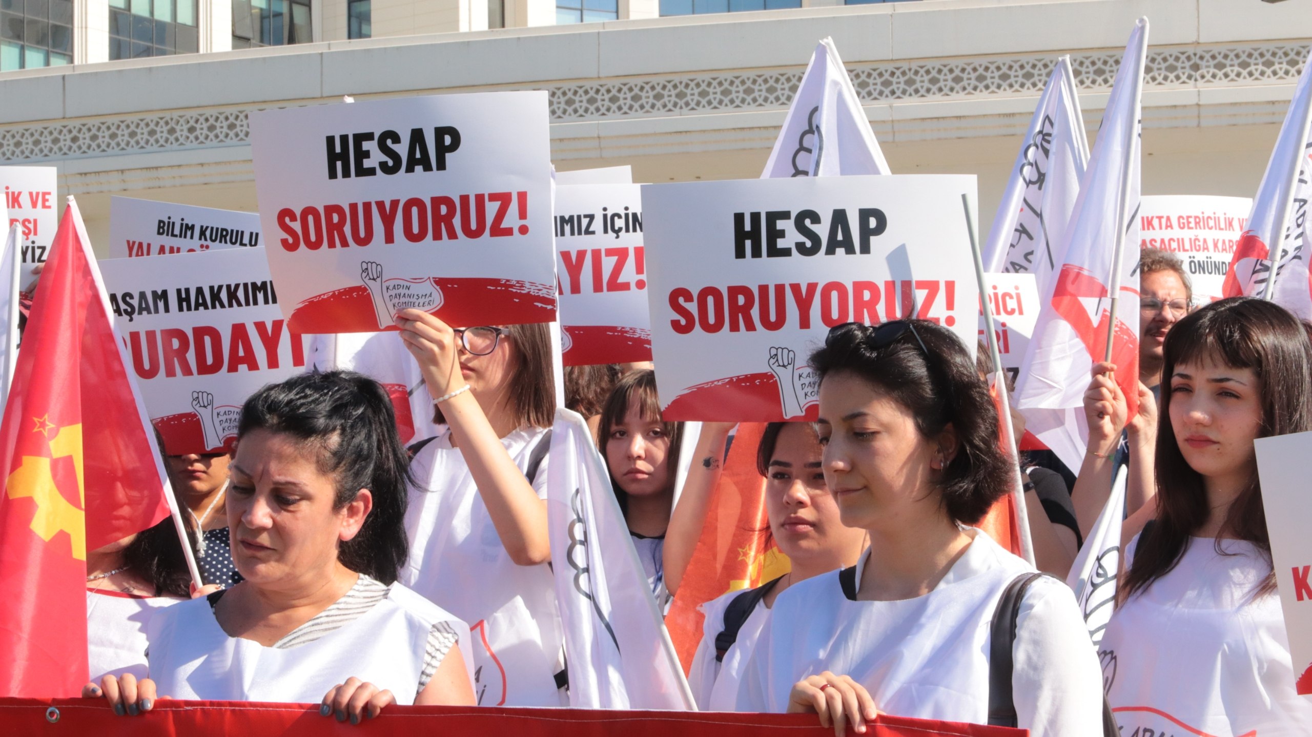 KDK members holding signs and flags during the protest in front of the Ministry of Health.