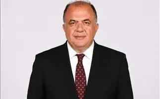 Portrait of Tolga Özdemir in a suit.