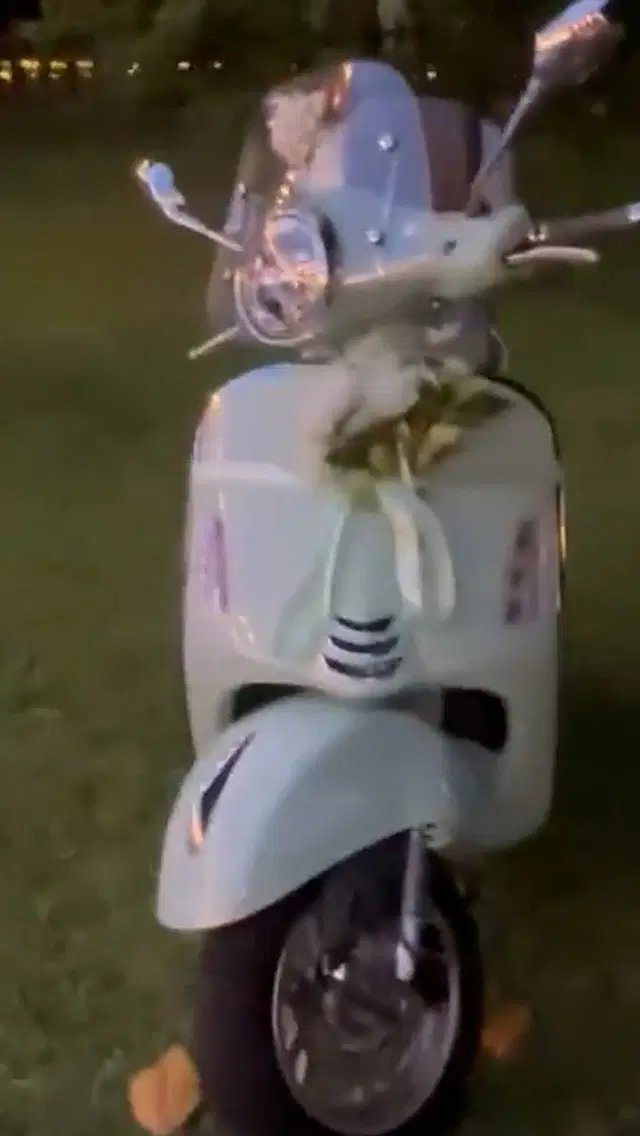 The white motorcycle prepared as an engagement gift.