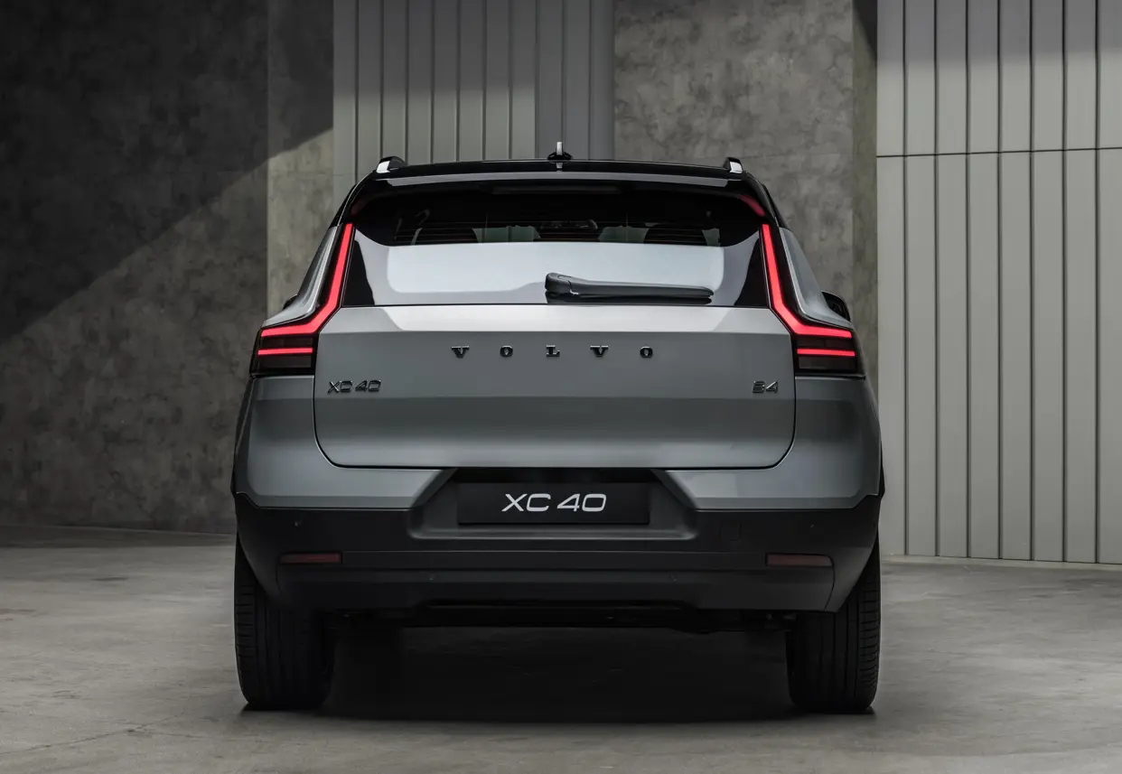 The rear design of the refreshed Volvo XC40 is seen with vertical LED taillights and model lettering.