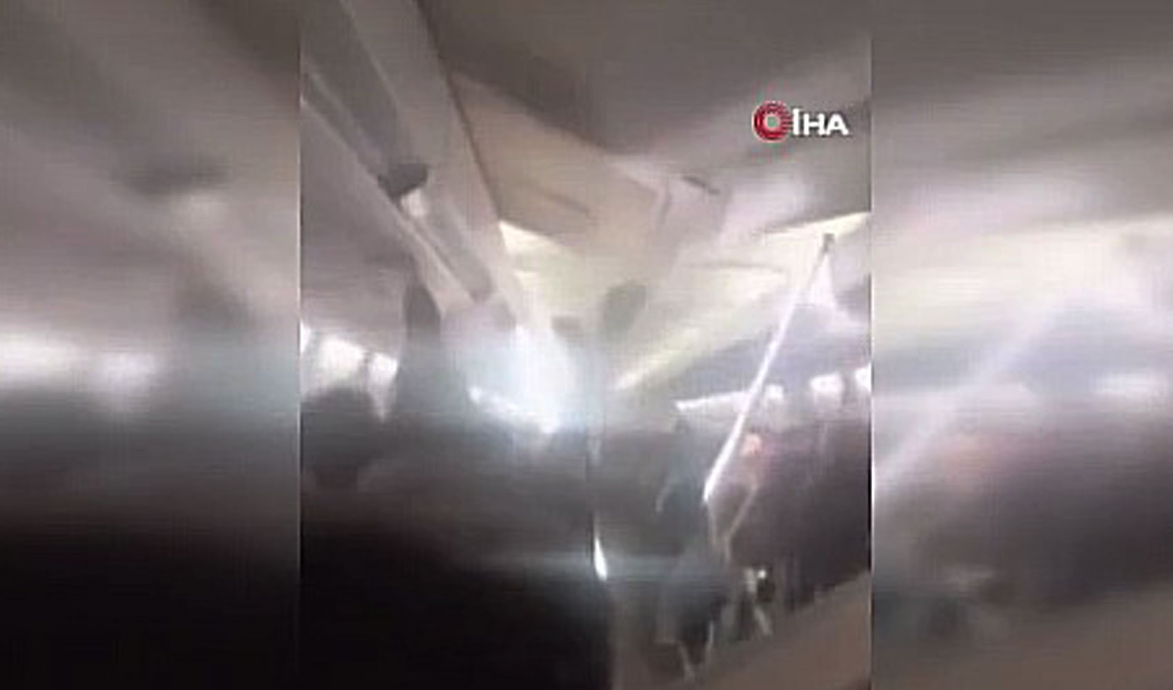 Terrifying moments on a passenger plane: Cabin ceiling collapses