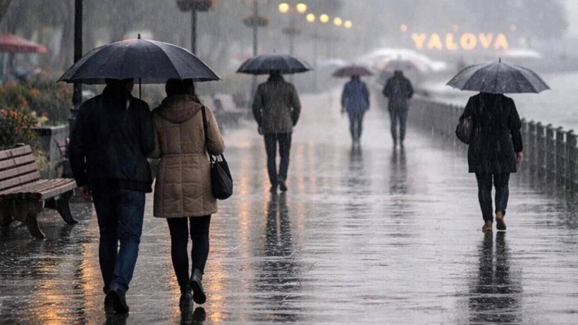 People walking with umbrellas in rainy weather.