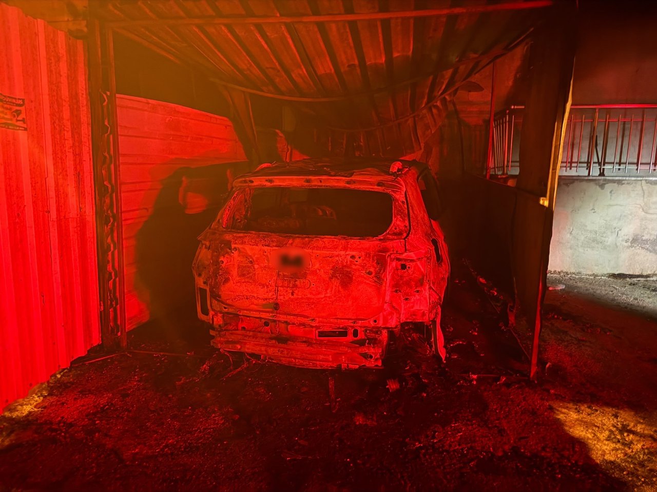 The burned and unusable car inside the garage and the damage after the fire are pictured.