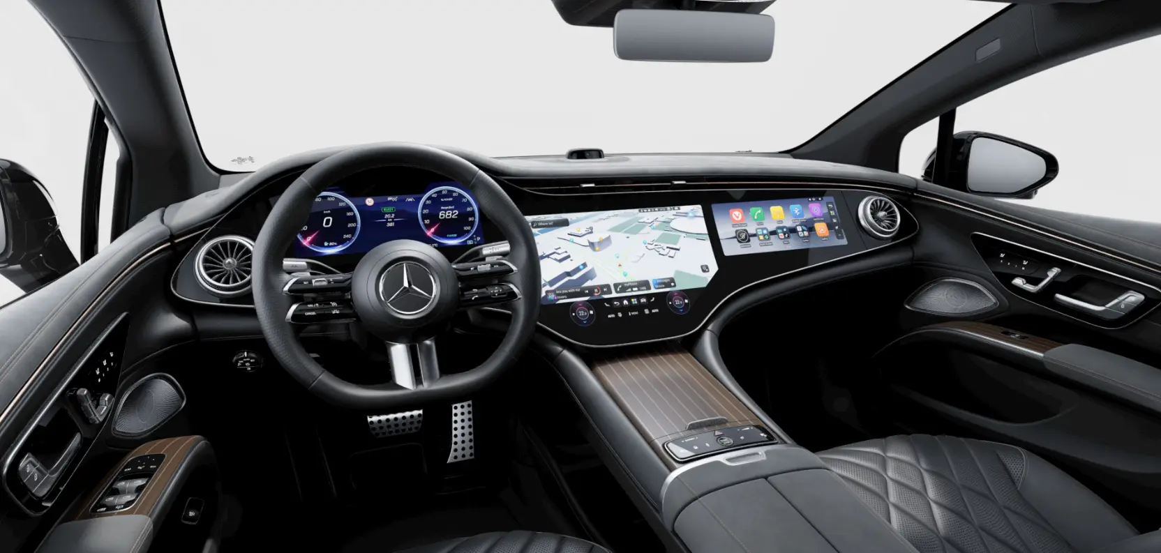 Mercedes-Benz EQS’in dijital gösterge paneli, merkezi ekranı ve lüks kabin tasarımını gösteren iç mekân fotoğrafı.