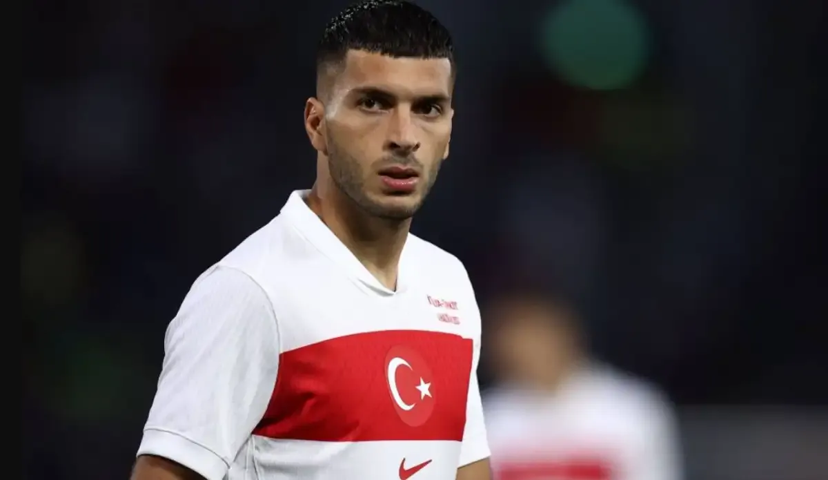 A photograph of Oğuz Aydın wearing the National Team jersey taken during a match.