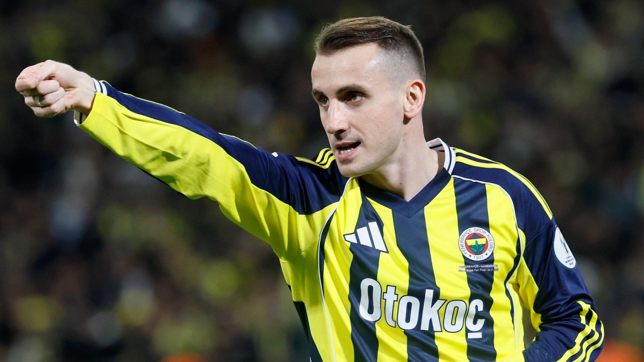 Kerem Aktürkoğlu seen on the pitch in a Fenerbahçe jersey.