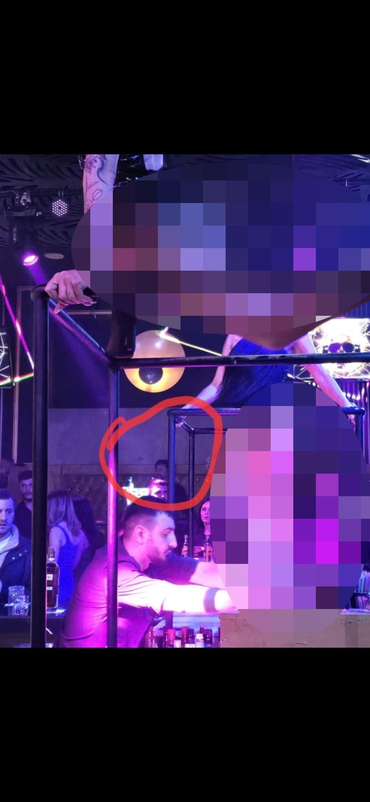 Image stated to have been taken in an entertainment venue with purple lights.